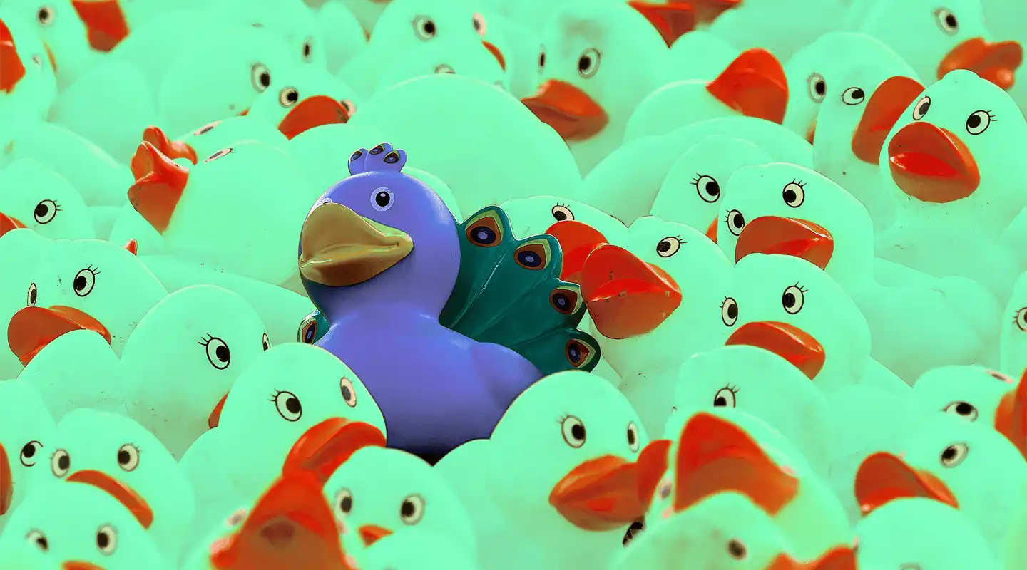 One rubber toy peacock amongst a sea of rubber ducks representing the Goldilocks customer targeting principle.